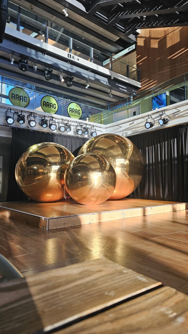 Gold Mirror Balls on Display at Bristol Beacon